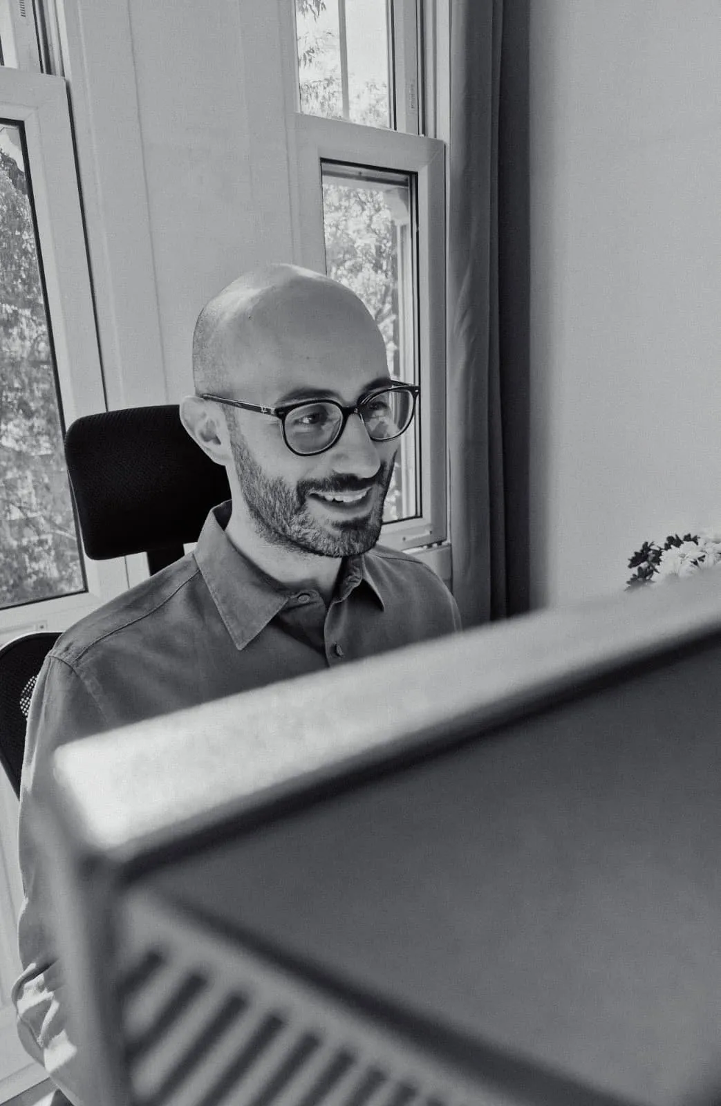 Simon working at a computer
